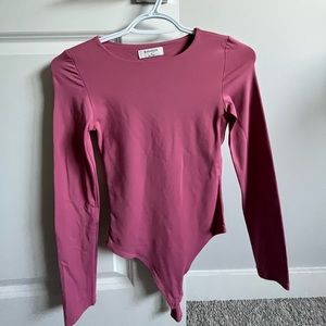 Aritzia Babaton Contour long sleeve bodysuit in the colour “rhodon pink”